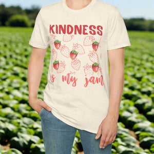Person wearing a t-shirt with 'Kindness is my jam' text and strawberry graphics on a white background